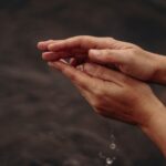 Inge's hands by the river